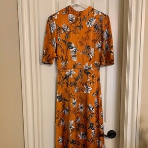Silk mockneck midi dress orange print